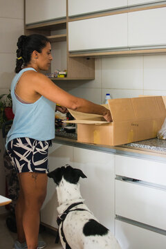 Woman organizing kitchen 
