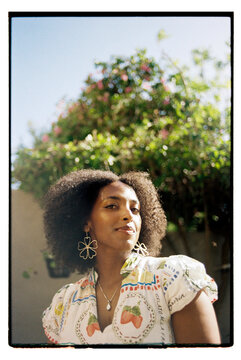 Wide angle portrait of woman with curly hair