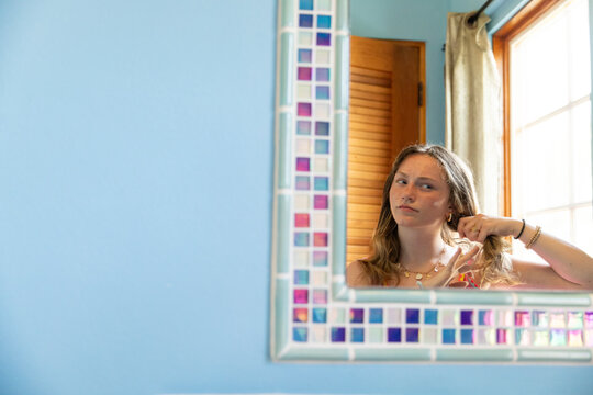 Teenager girl portrait in mirror  bathroom