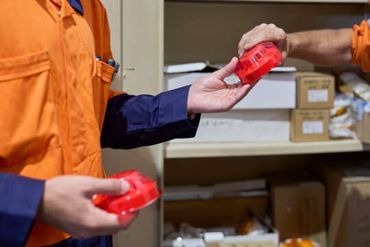 Workers handling fire safety equipment