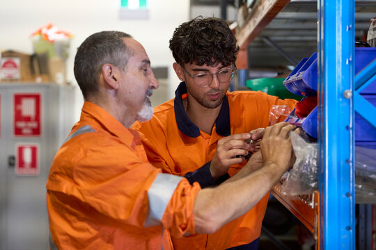 Young apprentice learning at workplace setting