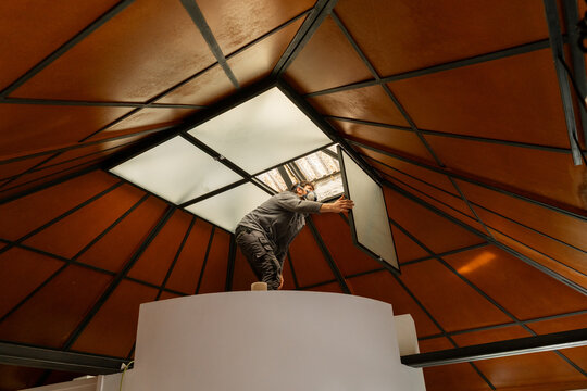 Worker repairing skylight