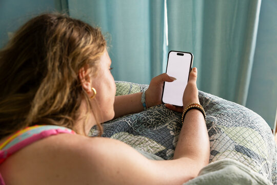 Teenager girl cell phone video streaming  in bedroom