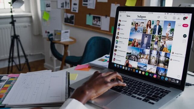 Managing social platform with creative tools nearby, Organizing digital content on laptop at creative workspace, Designing Instagram grid and planning audience interaction from creative desk area