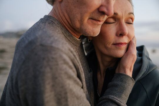 Mature Couple Sharing an Intimate and Loving Moment Outdoors