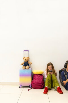 Young girl waiting for flight at airport