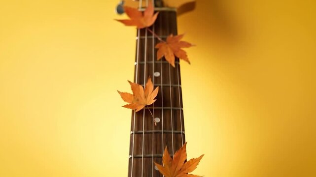 Close Up Electric Guitar Neck with Autumn Maple Leaves on Yellow Background 3D Render