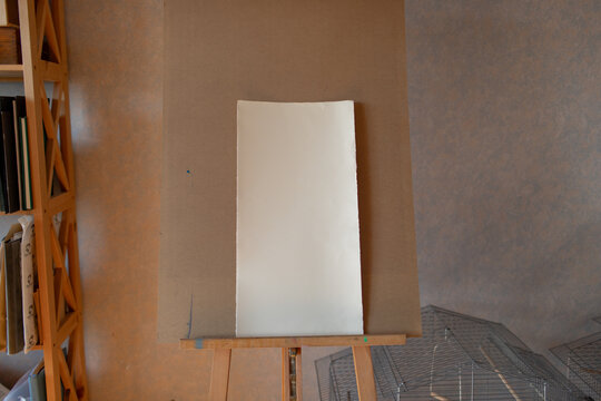 white canvas on an easel