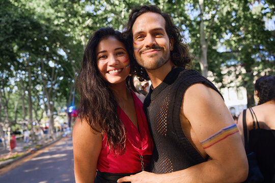 Friends celebrating pride with rainbow make up