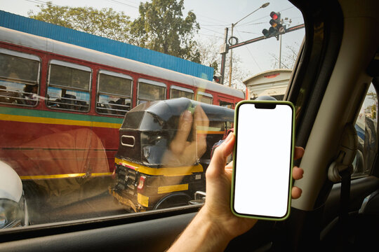 POV of Person Checking Phone While Waiting at Traffic Signal