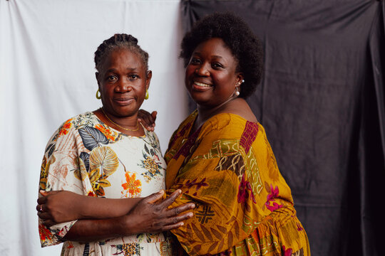 Mother and daughter holding onto each other