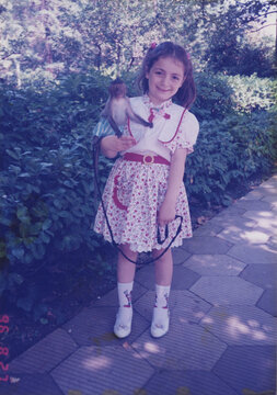 Tourist Photo Of A Girl With A Monkey