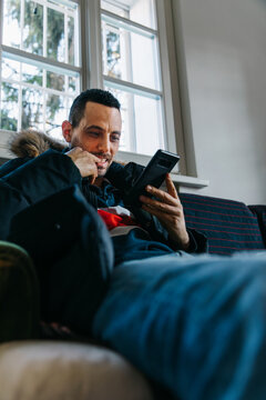 Man engaged in reading his smartphone