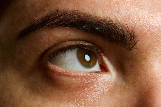 Macro shot of eye with vitiligo skin pattern