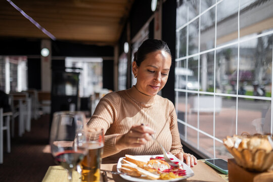 woman eating in a restaurant