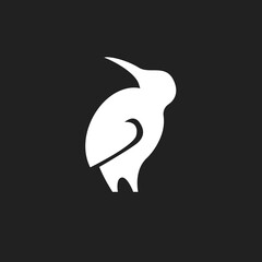 Obraz premium Minimalist White Kiwi Bird Silhouette Logo on Black Background