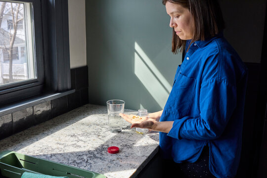 Woman taking her supplements