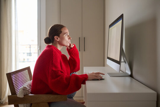 Pregnant Woman Focused on Work at Home in Cozy Setting