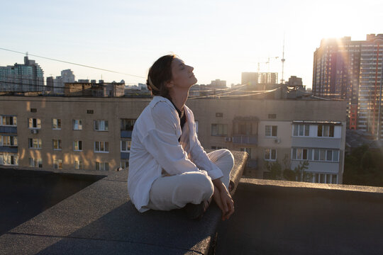 woman sitting on the roof