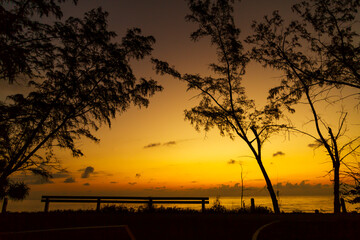 Sunrise on sea and silhouette of pnie © suthin3