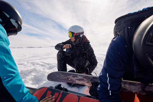 Skiers getting their equipment ready