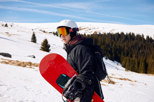 Man carries snowboard