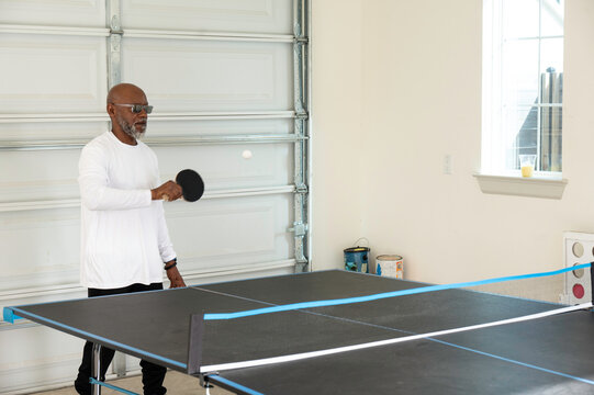 Playing Ping Pong In Garage