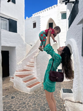 Happy Mom and Child in Benibecar, minorca in balearic island