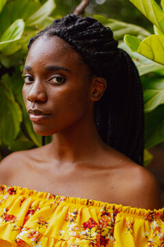 Black girl in a bright floral top