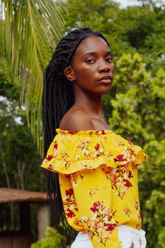 Black girl in a park looking at the camera