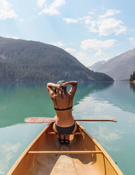 Woman in Wooden Canoe