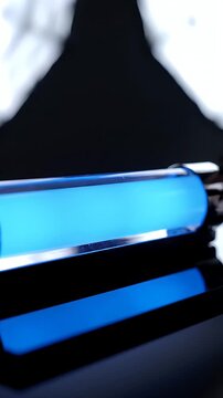 Abstract Close Up Of A Futuristic Water Cooling System Component With Blue Liquid Flowing Inside A Transparent Tube Set