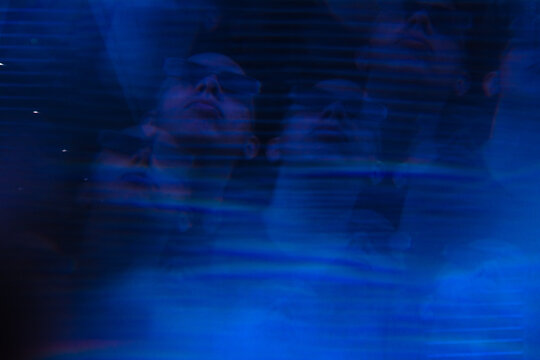 Blue distorted portrait of black man looking up 