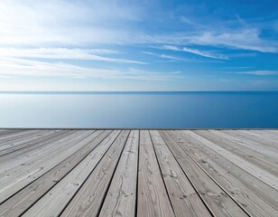 Weathered wooden pier extends towards the calm blue ocean under a bright sky
