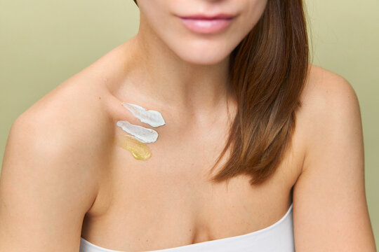 Spots of cosmetic cream on a woman's body