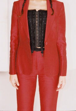 Bold fashion statement in an elegant red ensemble showcased by a model