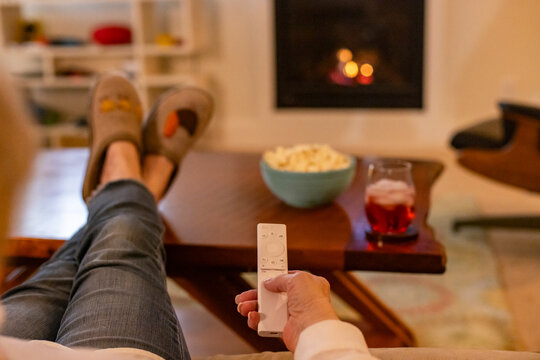 Hand on Television Remote Control 