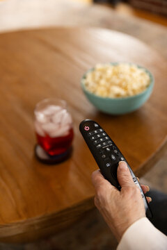 Hand with  tv remote control 
