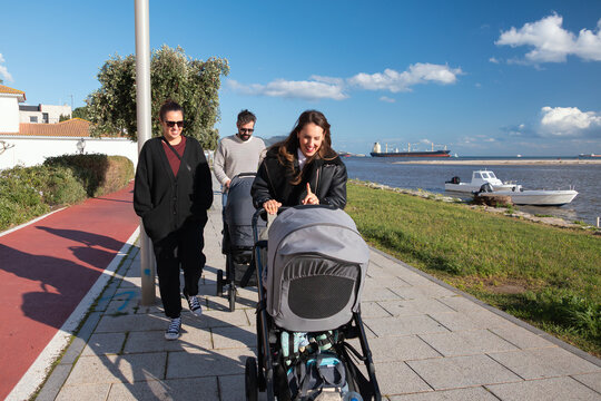 Parents walking with strollers