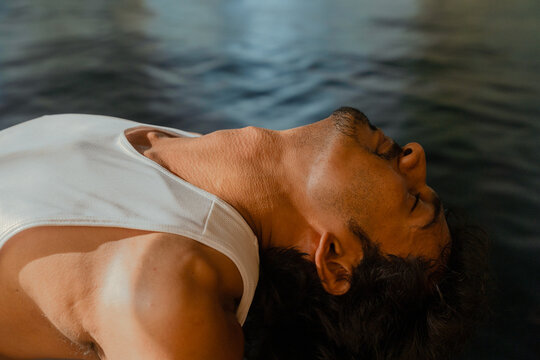 Man Practising Fish Pose Yoga Backbend for Chest Opener