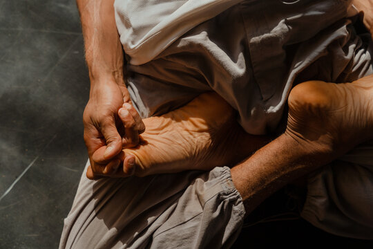 lose-Up of Hands and Feet in Padmasana Yoga Pose