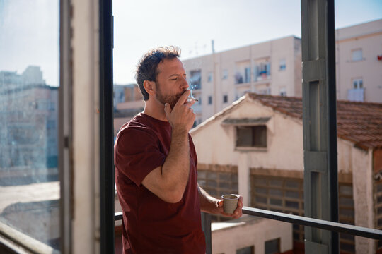 Man smoking on the balcony