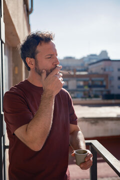 Man smoking on the balcony