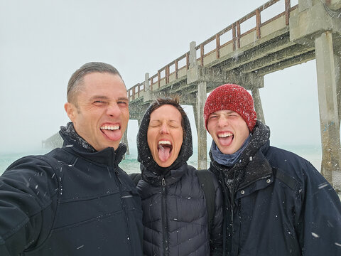 Family Selfie Having Fun in Winter Snow