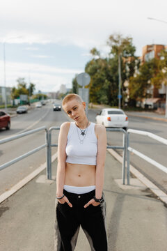 cool woman with short hair standing outdoors