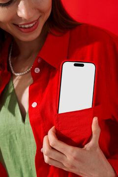 Mockup phone with white screen. Woman in Red Stylish Setting