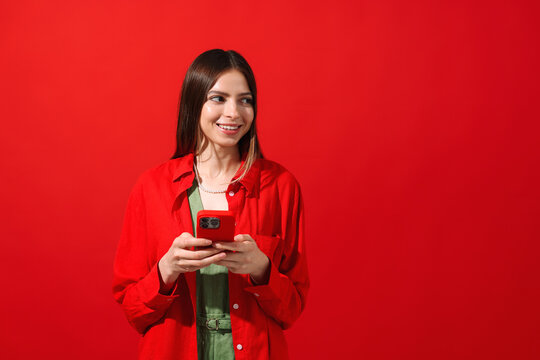 Smiling Woman Holding Red Phone