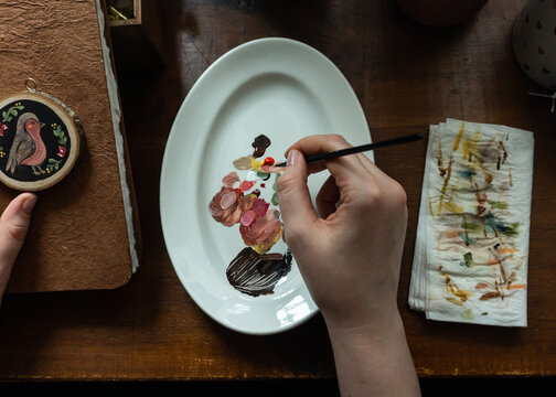 Crafting a charming hand-painted bird decoration