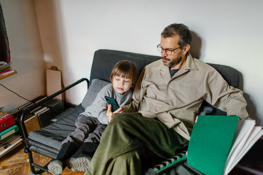 father and son spending time together in the office