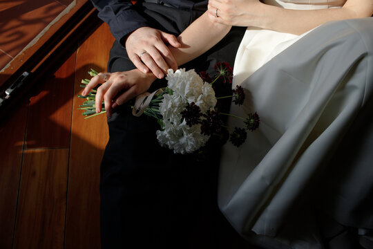 couple in wedding clothes at home
